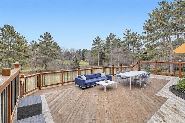 16439 Tippecanoe St NE, Ham Lake, MN 55304 - deck featuring an outdoor hangout area, outdoor dining area, and view of wooded area