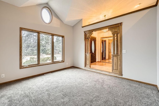 16439 Tippecanoe St NE, Ham Lake, MN 55304 - spare room featuring light carpet, vaulted ceiling, and baseboards