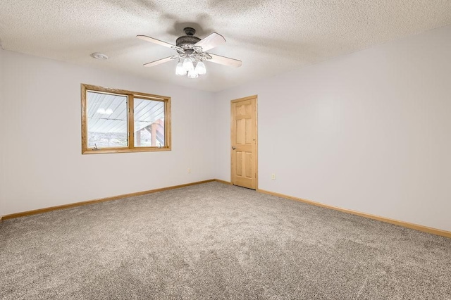16439 Tippecanoe St NE, Ham Lake, MN 55304 - spare room with light colored carpet, ceiling fan, baseboards, and a textured ceiling