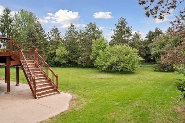 16439 Tippecanoe St NE, Ham Lake, MN 55304 - view of green lawn featuring stairs, a patio, and a deck