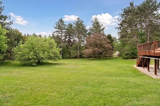 16439 Tippecanoe St NE, Ham Lake, MN 55304 - view of green lawn with a wooden deck and stairway