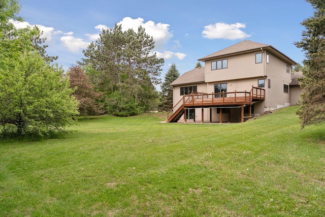 16439 Tippecanoe St NE, Ham Lake, MN 55304 - rear view of property featuring stairs, a wooden deck, and a lawn