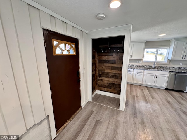 entrance foyer featuring light wood-style floors