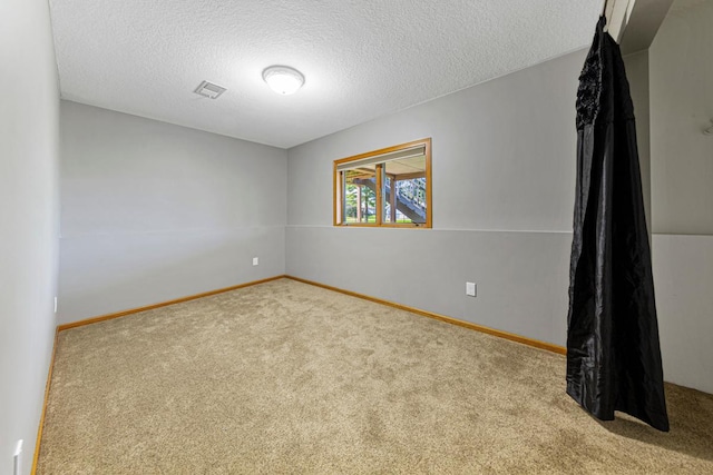 8370 Hamel Way, Morristown, MN 55052 - unfurnished room featuring carpet floors, a textured ceiling, and baseboards