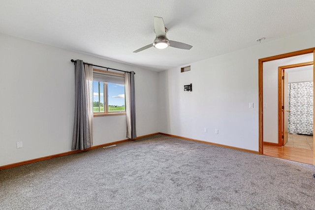 8370 Hamel Way, Morristown, MN 55052 - unfurnished room with carpet flooring, ceiling fan, and baseboards