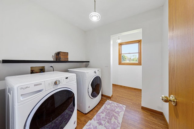 8370 Hamel Way, Morristown, MN 55052 - laundry room with separate washer and dryer, light wood finished floors, and baseboards