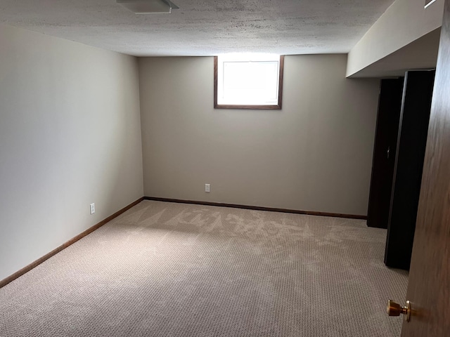 basement with carpet floors and baseboards