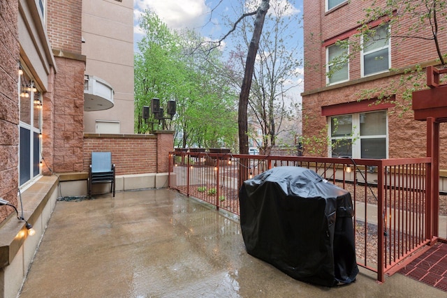 view of patio / terrace with a wooden deck and area for grilling