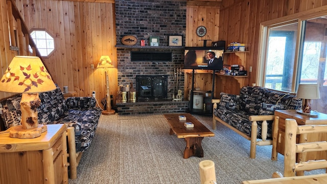 carpeted living room with wood walls and plenty of natural light