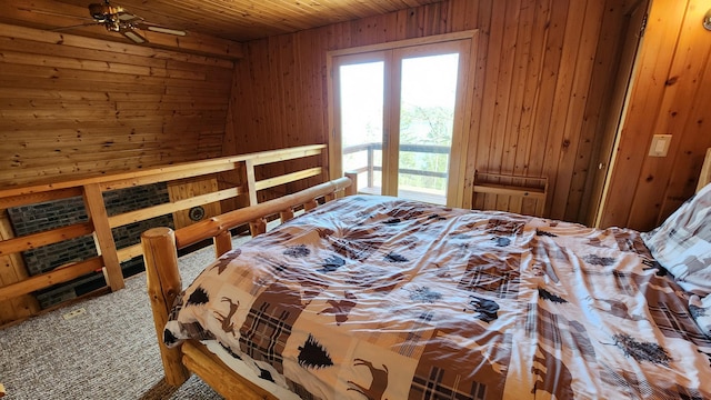 bedroom featuring wooden walls and wood ceiling