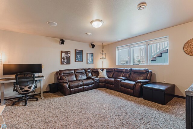 carpeted living room with baseboards