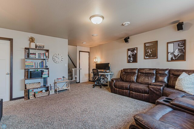 living area with carpet floors and baseboards