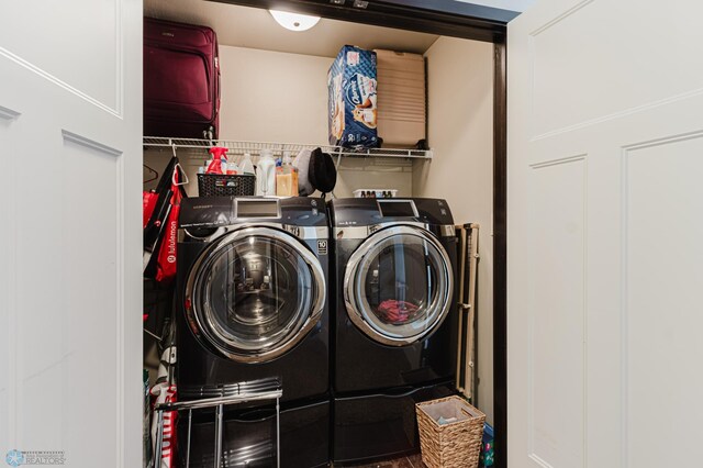 clothes washing area with washing machine and clothes dryer