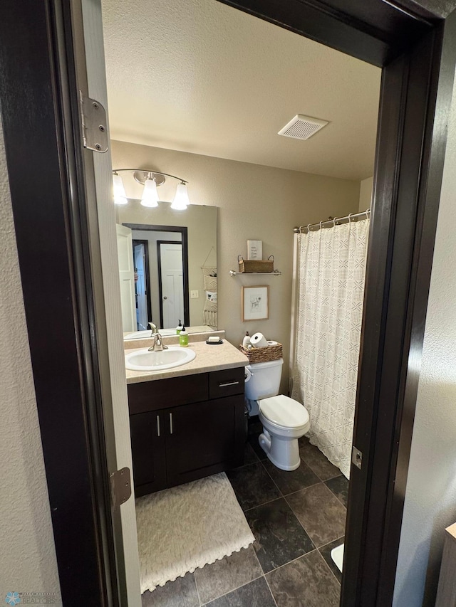 5595 Tuscan Ct S, Fargo, ND 58104 - bathroom with toilet, vanity, and tile patterned floors