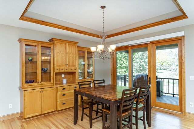 1315 Wicklow Ln SW, Rochester, MN 55902 - dining room with a raised ceiling, light wood-style floors, and a chandelier