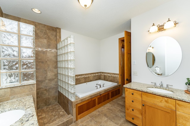 1315 Wicklow Ln SW, Rochester, MN 55902 - bathroom with vanity, a bath, a walk in shower, and a textured ceiling