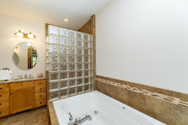 1315 Wicklow Ln SW, Rochester, MN 55902 - full bath with a tub with jets, walk in shower, and vanity