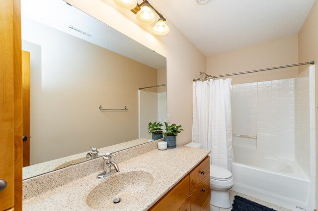 1315 Wicklow Ln SW, Rochester, MN 55902 - full bathroom with vanity, shower / tub combo with curtain, toilet, and tile patterned flooring