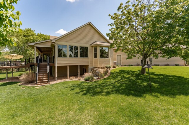 1315 Wicklow Ln SW, Rochester, MN 55902 - back of house with stairway, a wooden deck, and a lawn