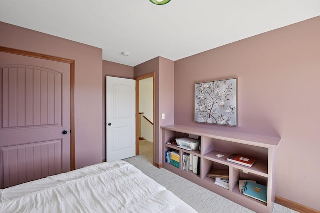 carpeted bedroom with baseboards