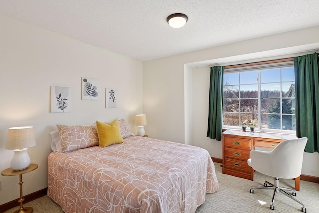 carpeted bedroom with baseboards