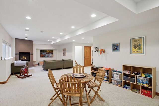 carpeted dining room featuring recessed lighting, baseboards, and a large fireplace