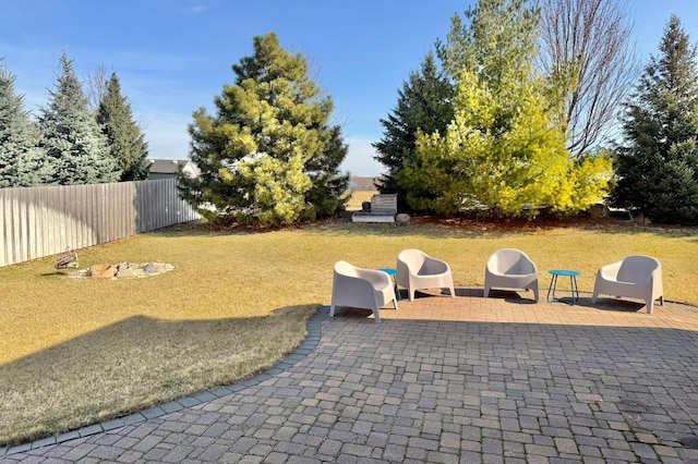 view of yard featuring fence and a patio