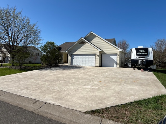 view of front of property with driveway and a garage