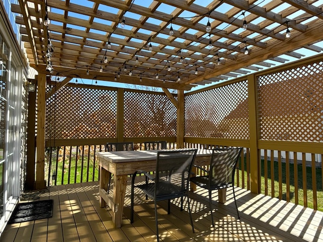 deck with outdoor dining area and a pergola