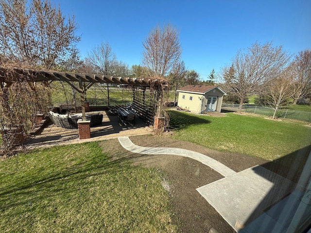 view of yard featuring an outdoor structure, a patio area, fence, and a pergola