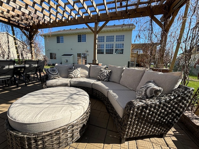 view of patio with an outdoor living space, a pergola, and outdoor dining space