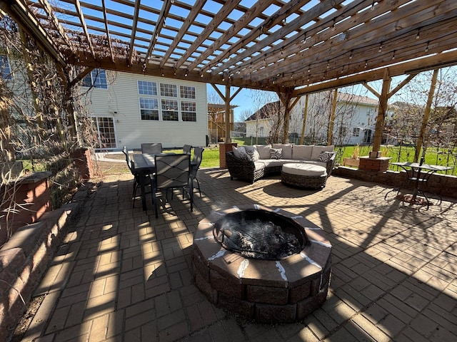 view of patio / terrace with outdoor dining area, an outdoor living space with a fire pit, and a pergola