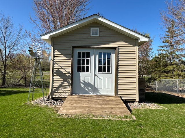 view of shed with fence