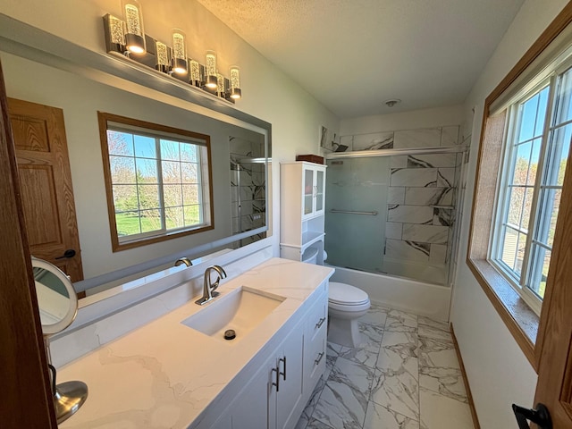 full bathroom featuring shower / bath combination with glass door, toilet, marble finish floor, and vanity