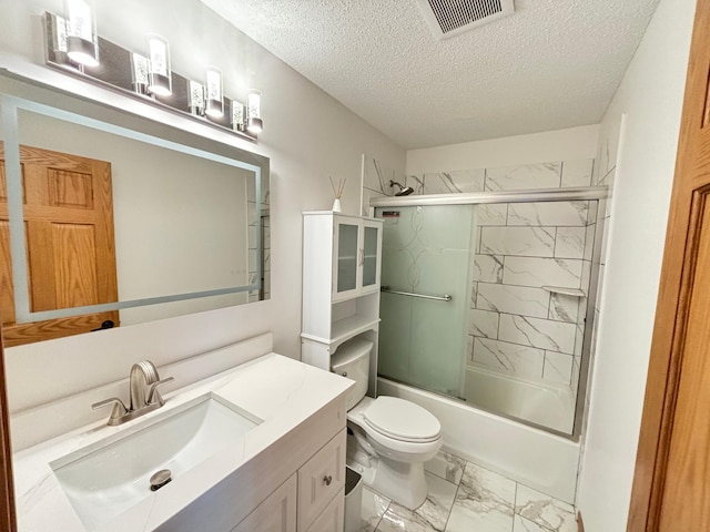 bathroom with visible vents, marble finish floor, toilet, a textured ceiling, and enclosed tub / shower combo