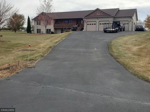 1603 86th Ave, Hammond Twp, WI 54015 - view of front facade with an attached garage, a front lawn, and driveway