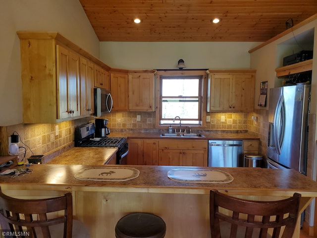 1603 86th Ave, Hammond Twp, WI 54015 - kitchen featuring stainless steel appliances, a sink, wooden ceiling, light brown cabinets, and a peninsula