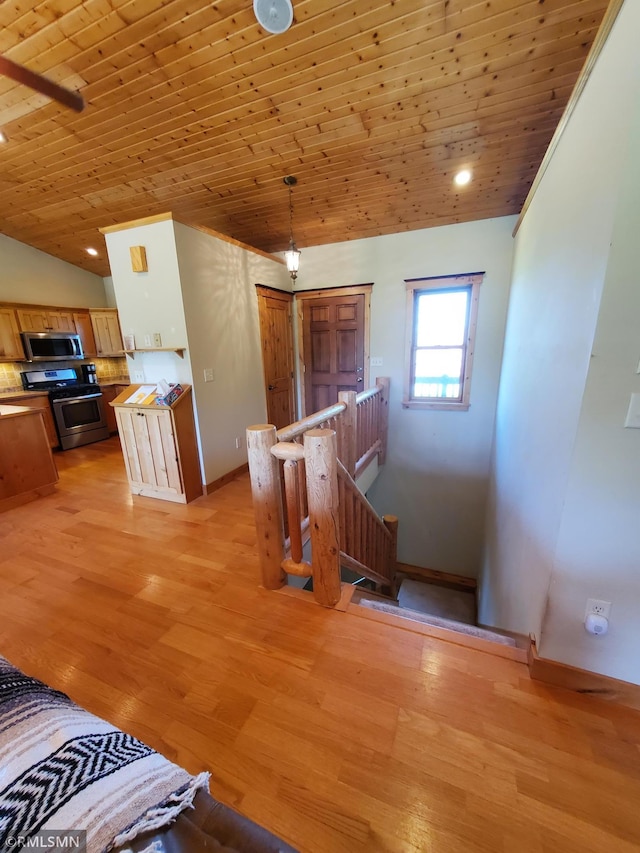 1603 86th Ave, Hammond Twp, WI 54015 - corridor featuring an upstairs landing, wood ceiling, lofted ceiling, baseboards, and light wood-style flooring