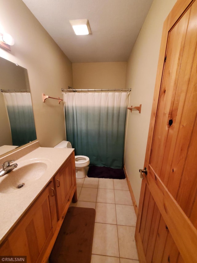 1603 86th Ave, Hammond Twp, WI 54015 - full bath with vanity, toilet, tile patterned floors, and a shower with shower curtain