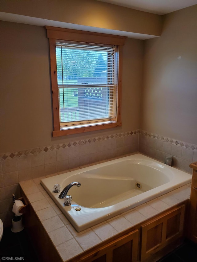 1603 86th Ave, Hammond Twp, WI 54015 - full bathroom featuring a bath, toilet, and tile walls
