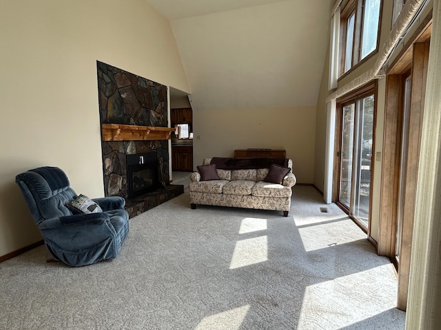 living area featuring high vaulted ceiling, carpet, and a fireplace