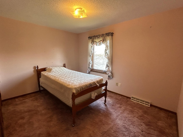 bedroom featuring visible vents, carpet, and baseboards