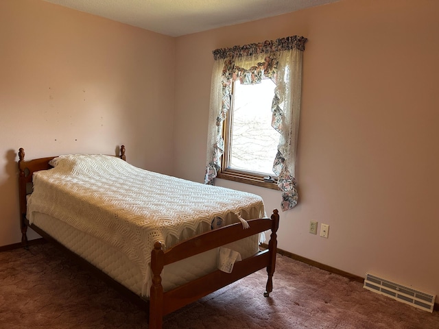 bedroom with baseboards, carpet flooring, and visible vents
