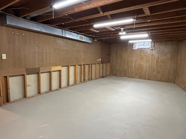 below grade area featuring wooden walls