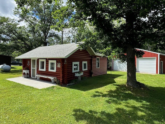 27530 Steel Bridge Rd NE, Waskish, MN 56685 - exterior space with a lawn, log siding, an outdoor structure, and roof with shingles