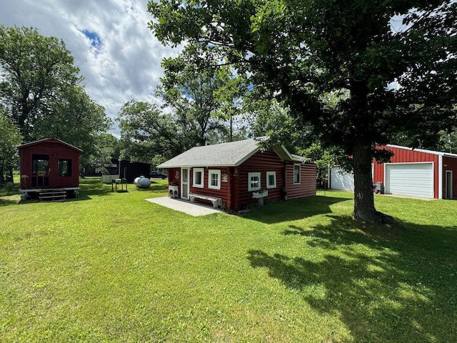 27530 Steel Bridge Rd NE, Waskish, MN 56685 - view of yard featuring a garage and an outbuilding