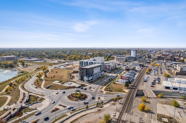 birds eye view of property with a view of city and a water view