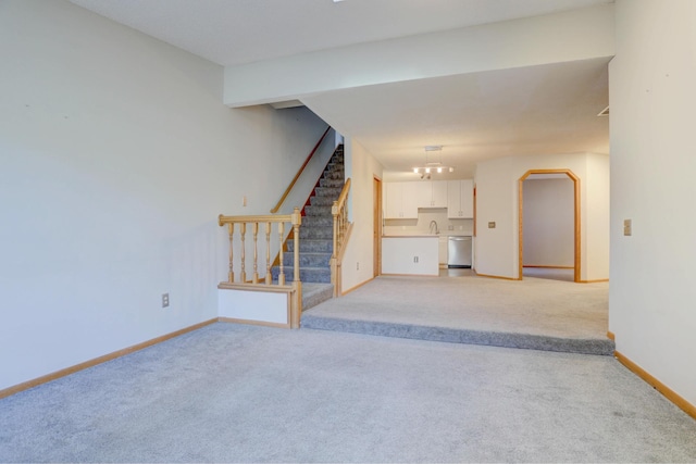 1870 Southpointe Ter Unit W1870, Eagan, MN 55122 - unfurnished living room with baseboards, light carpet, and stairway