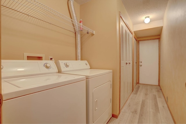 1870 Southpointe Ter Unit W1870, Eagan, MN 55122 - washroom with light wood-style floors, washer and clothes dryer, baseboards, and laundry area