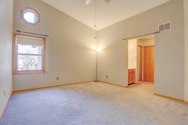 1870 Southpointe Ter Unit W1870, Eagan, MN 55122 - spare room with baseboards, light colored carpet, a wealth of natural light, and visible vents